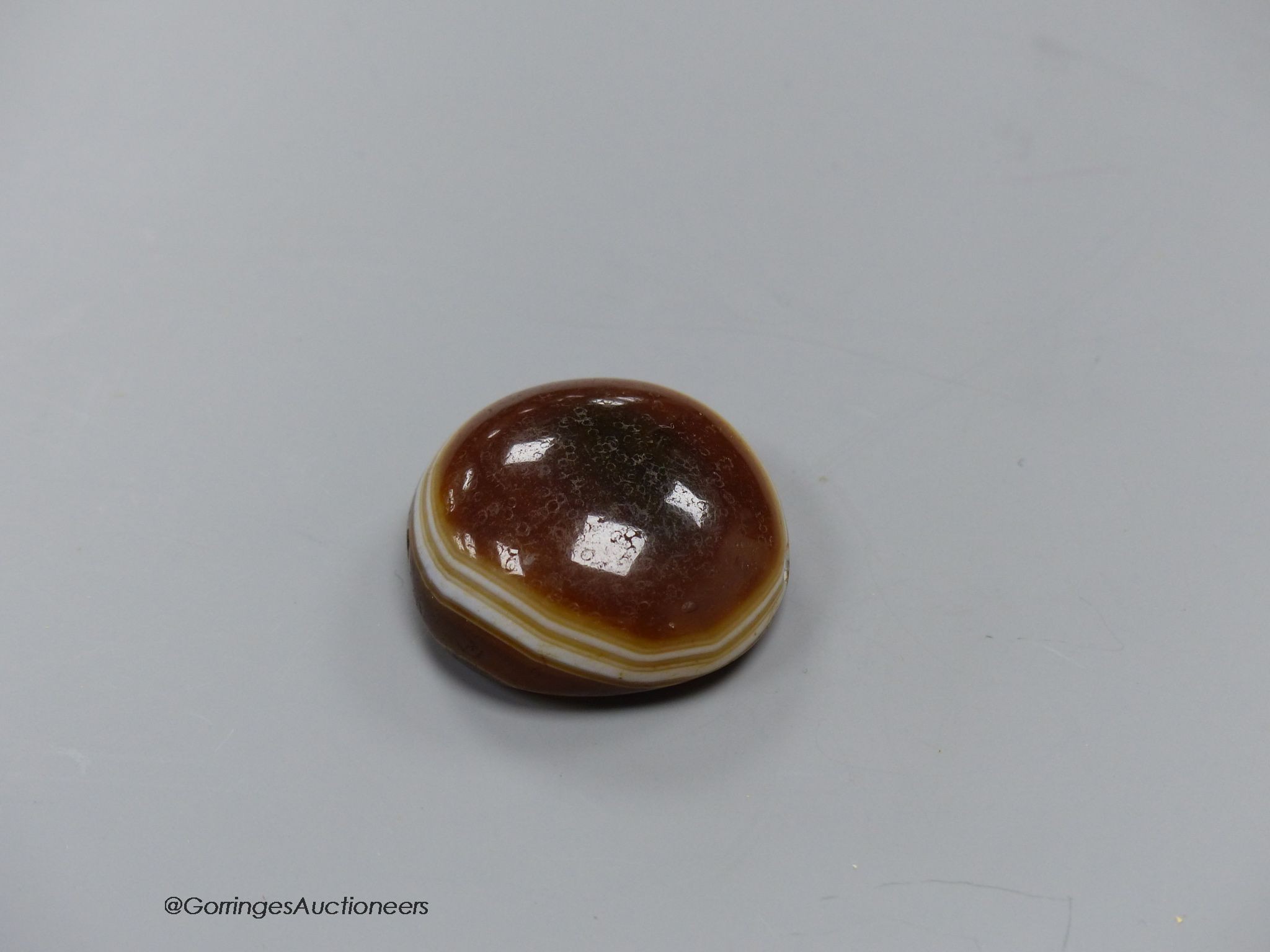 A cased agate pendant